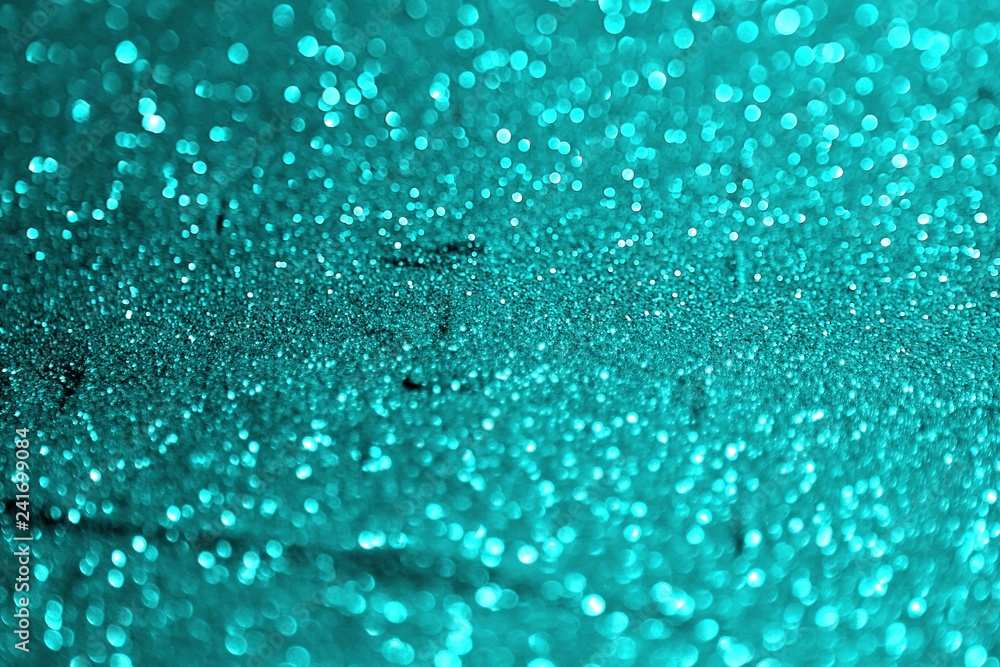 light blue painted aluminium sand made of glitters - multi colored concept with bokeh texture - wonderful abstract photo background light blue painted aluminium sand made of glitters - multi colored concept with bokeh texture - wonderful abstract photo background