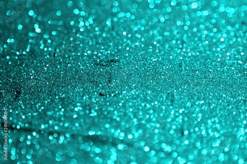 light blue painted aluminium sand made of glitters - multi colored concept with bokeh texture - wonderful abstract photo background