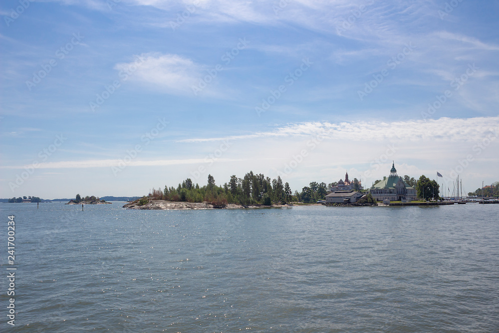 View of small islands in the Gulf of Finland near the city of Helsinki in Finland on a summer day. Ferry trip around the Gulf of Finland.