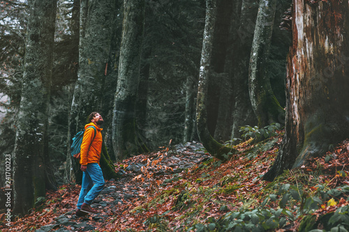 Man walking alone in deep forest Travel healthy active lifestyle adventure vacations outdoor exploring wilderness © EVERST