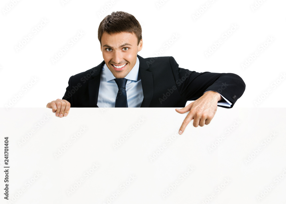 Happy businessman showing signboard, isolated Happy businessman showing signboard, isolated
