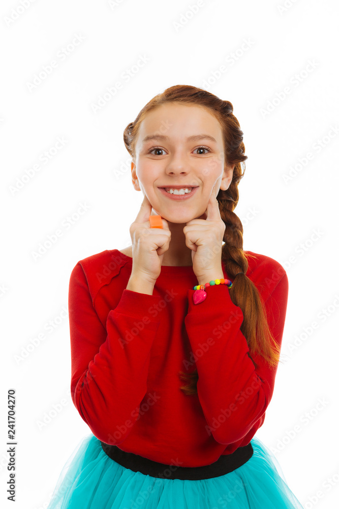 Pretty smiley girl pressing her cute cheeks Pretty smiley girl pressing her cute cheeks