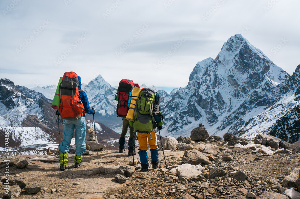 Three backpackers in the Himalayas