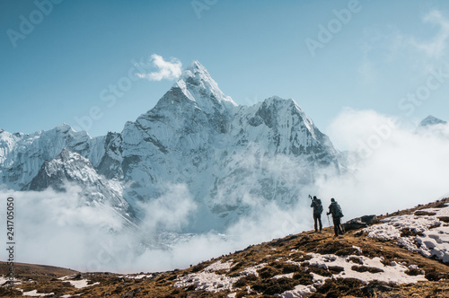 Travellers near Ama Dablam peak in Sagarmatha, Nepal