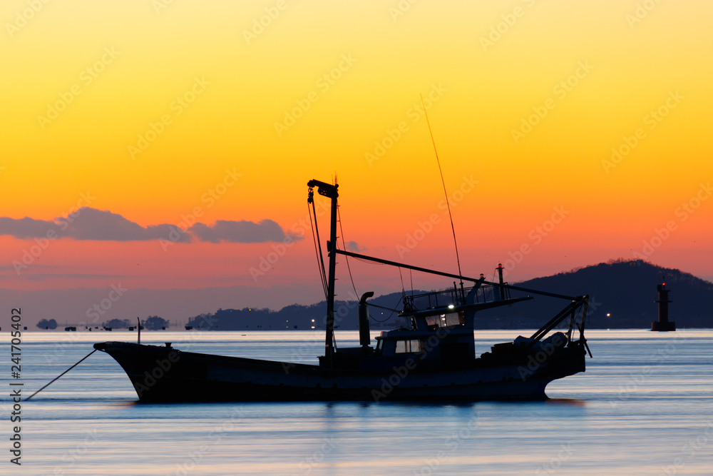 Anchored sea fishing boat.  sunset and fishing boat.  korea west sea. Ganghwa-gun, Incheon, Republic of Korea.