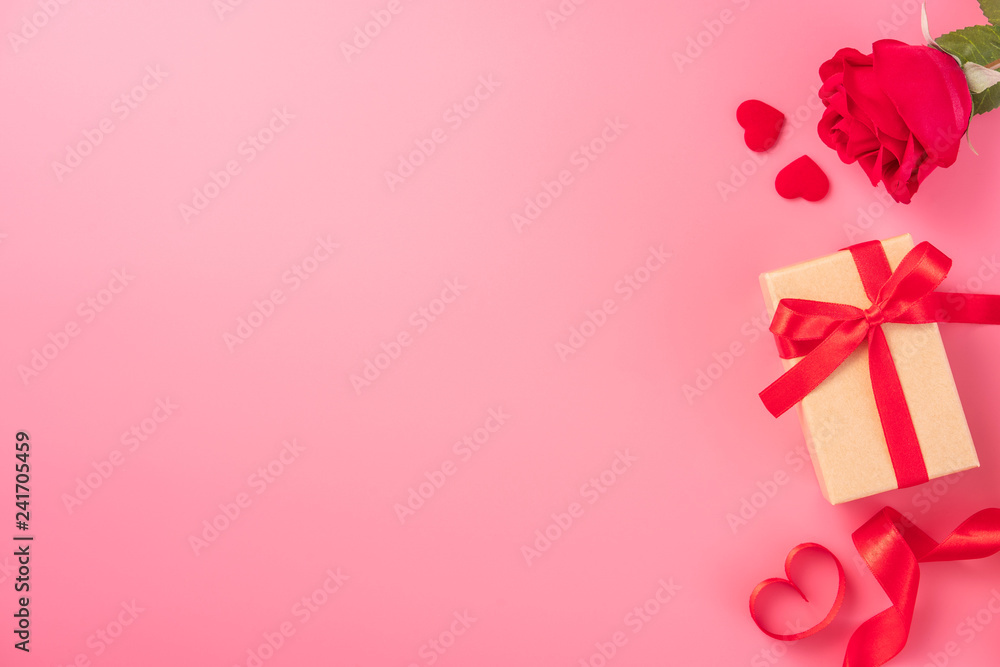 Kraft Gift box with beautful red ribbon and rose, concept of Valentine's, anniversary, mother's day and birthday greeting, copy space, top view. Kraft Gift box with beautful red ribbon and rose, concept of Valentine's, anniversary, mother's day and birthday greeting, copy space, top view.