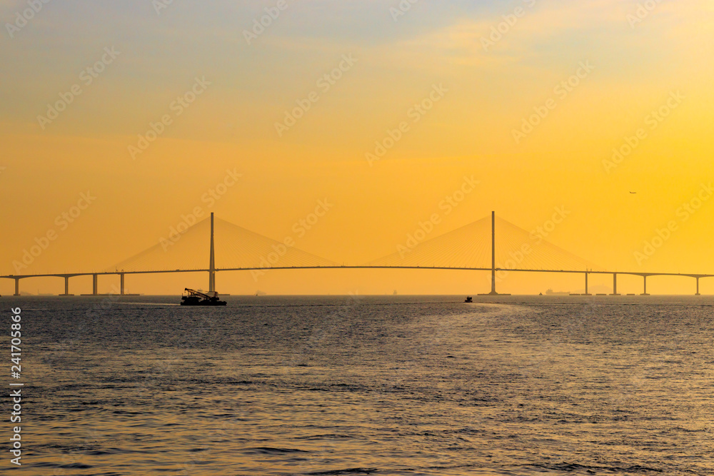 Scenery with Incheon Bridge and ship. Beautiful sea bridge. Incheon Bridge with sunset.