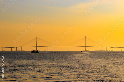 Scenery with Incheon Bridge and ship. Beautiful sea bridge. Incheon Bridge with sunset.
