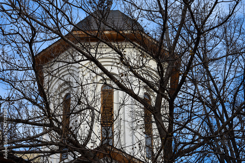 Bucharest, Romania. February 5, 2017. Orthodox Church behind the branches. photo