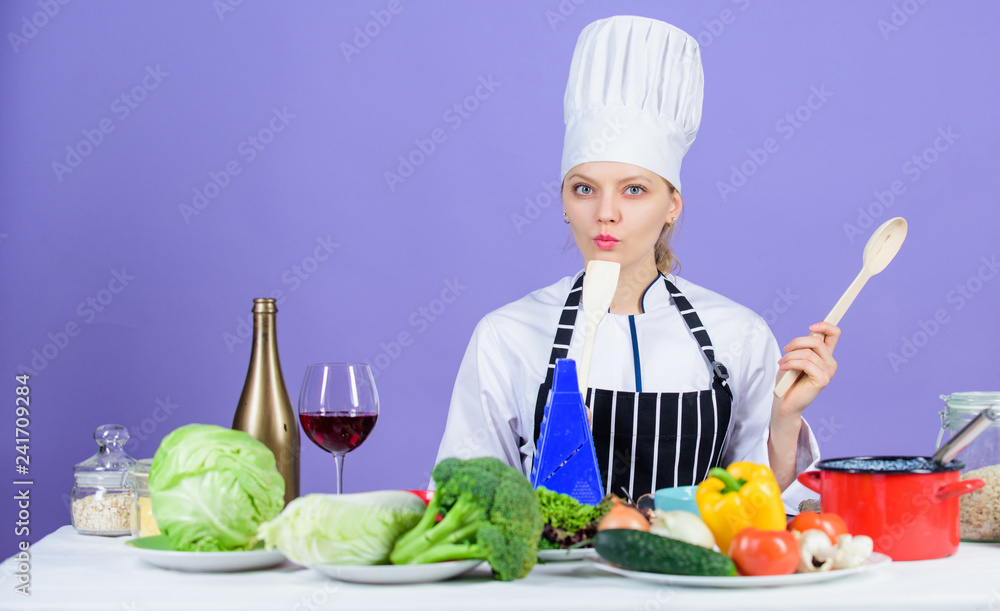 Gourmet main dish recipes. Cooking is her hobby. Cooking healthy food. Girl in hat and apron. Woman chef cooking healthy food. Fresh vegetables ingredients for cooking meal. Delicious recipe concept Gourmet main dish recipes. Cooking is her hobby. Cooking healthy food. Girl in hat and apron. Woman chef cooking healthy food. Fresh vegetables ingredients for cooking meal. Delicious recipe concept
