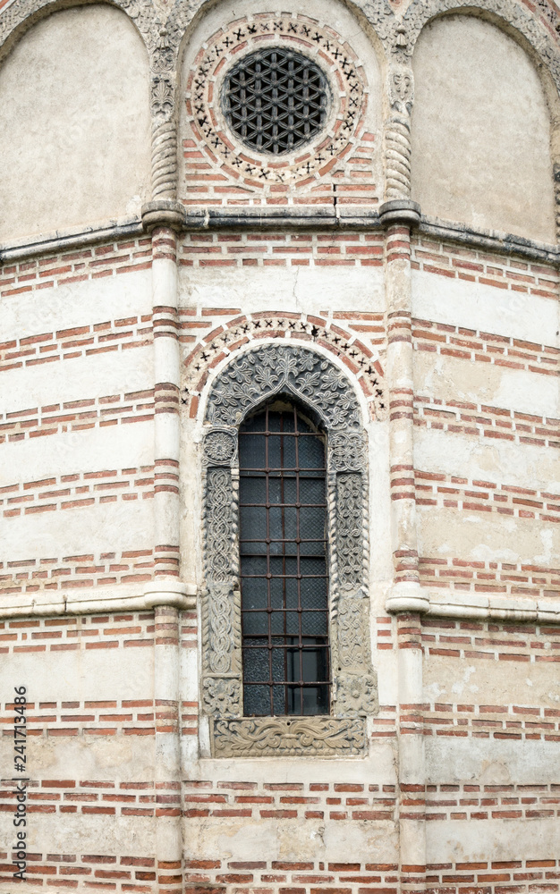 Window on the façade of a stone wall