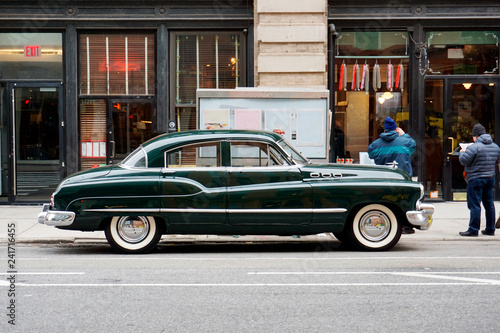 Side view of a classic vintage car in the street in NYC © CoolimagesCo