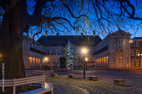 public square in front of Noordeinde Palace at dusk