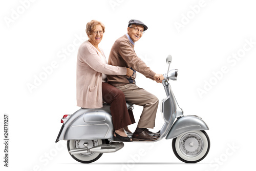 Senior man and woman on a vintage scooter