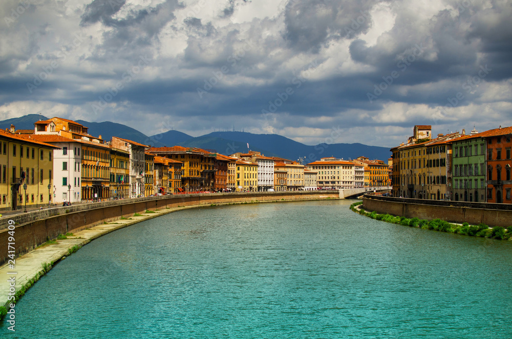 View on  Arno River in Pisa with rain clouds