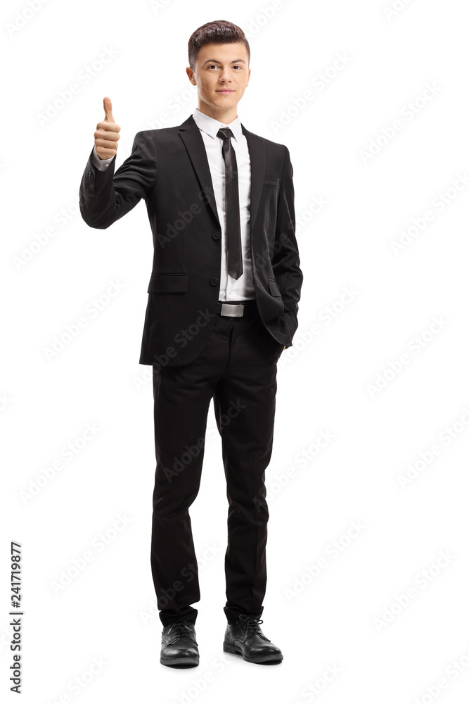 Young male adult in an elegant suit giving thumbs up Young male adult in an elegant suit giving thumbs up
