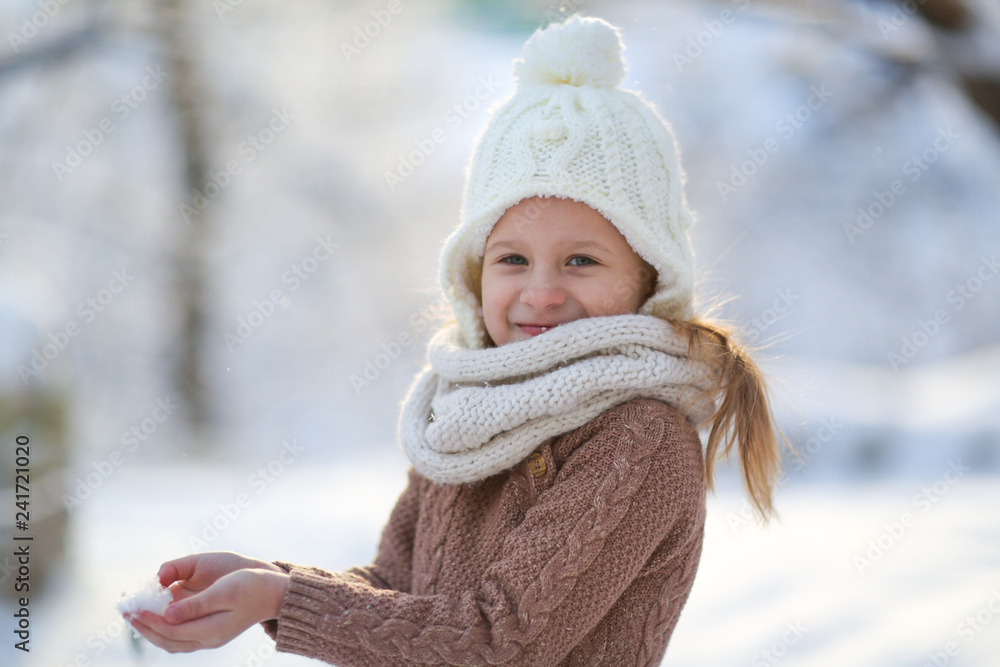 Funny girl and snow, closeup portrait. Winter Funny girl and snow, closeup portrait. Winter