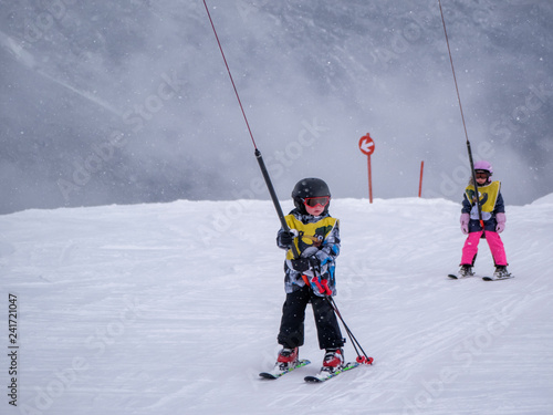 Zams, Austria - 22 Februar 2015: Children in ski school. Ski resort. Surface lift