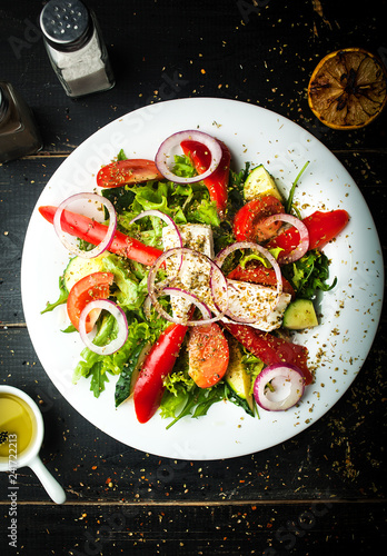 Delicious Greek salad of fresh vegetables on a plate