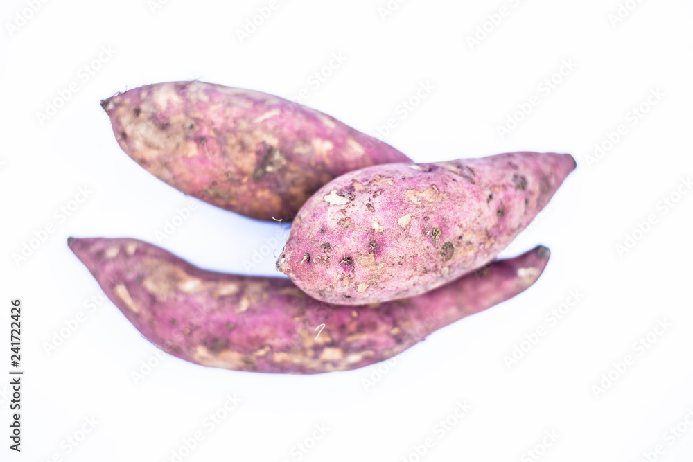 Close up of raw organic sweet potatoes or Ipomoea batatas or  Shakarkandi   isolated on white.