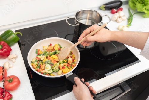 Fresh vegetables fried in a pan. Healthy nutrition concept