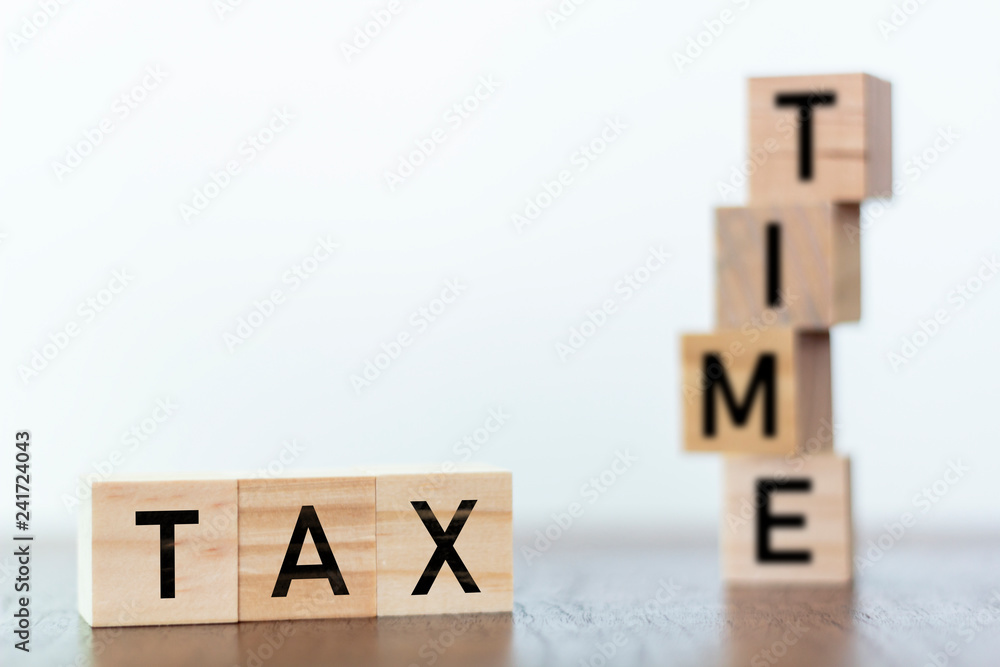 Tax Time on wooden cubes with copy space Tax Time on wooden cubes with copy space