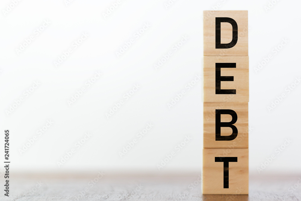 Debt written on wooden cubes with copy space Debt written on wooden cubes with copy space