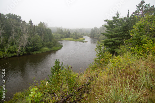 Au Sable River. Fog in a river valley of the famous Au Sable River in the Lower Peninsula of Michigan. The river is the centerpiece of the Huron National Forest.