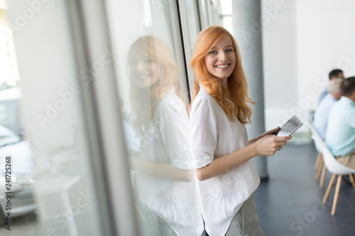 Pretty young red hair woman...