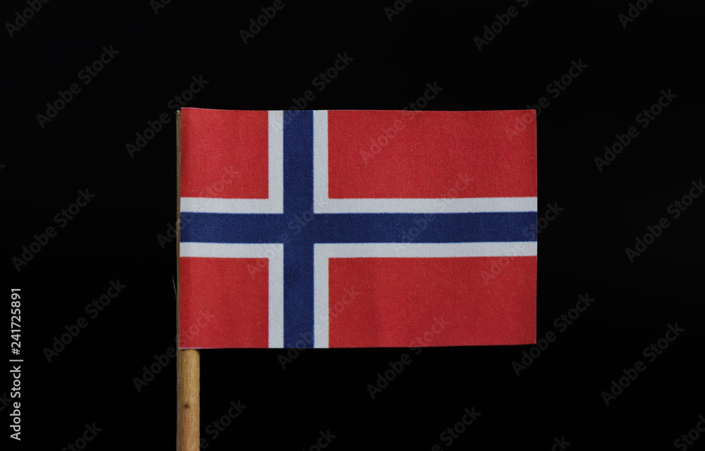 Foto de A original and very similar other nothern lands of Europe, flag of Norway on toothpick on black background. Red field charged with white-fimbriated blue cross extends to