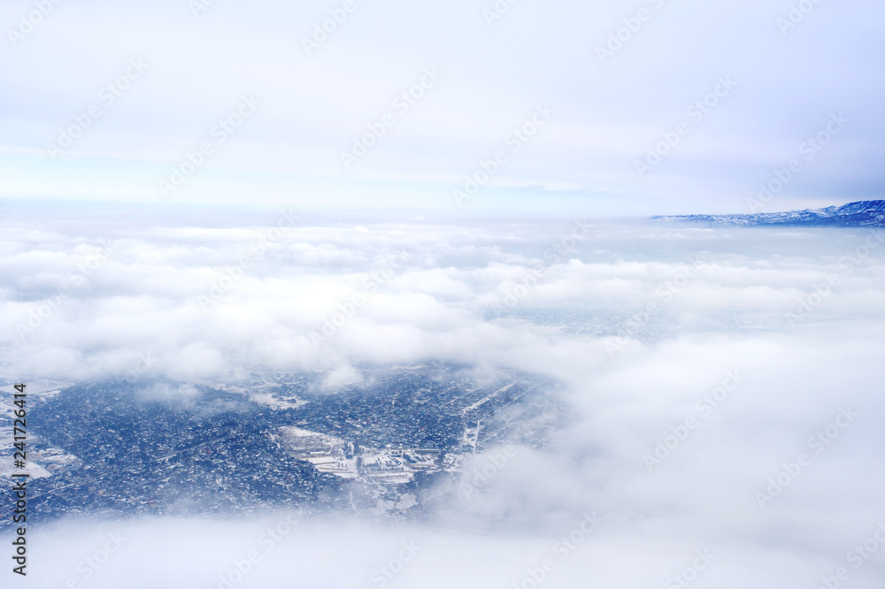 aerial view of clouds over city from airplane aerial view of clouds over city from airplane