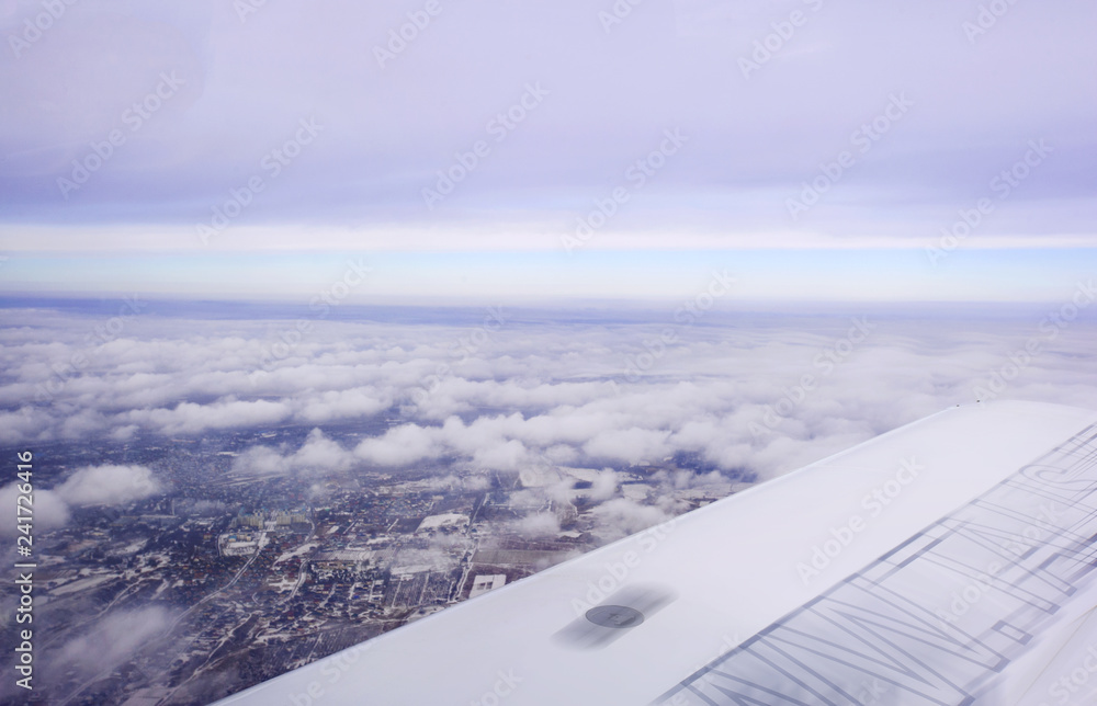 aerial view of clouds over city from airplane aerial view of clouds over city from airplane