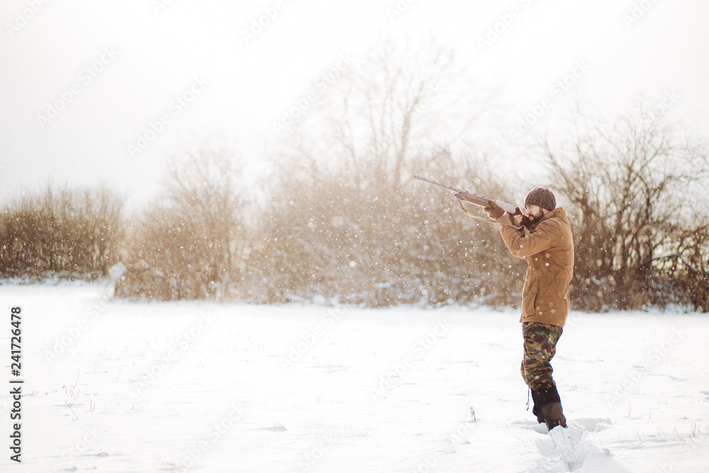 young active man is spending time on shooting. side view photo. good weather for hunting. copy space