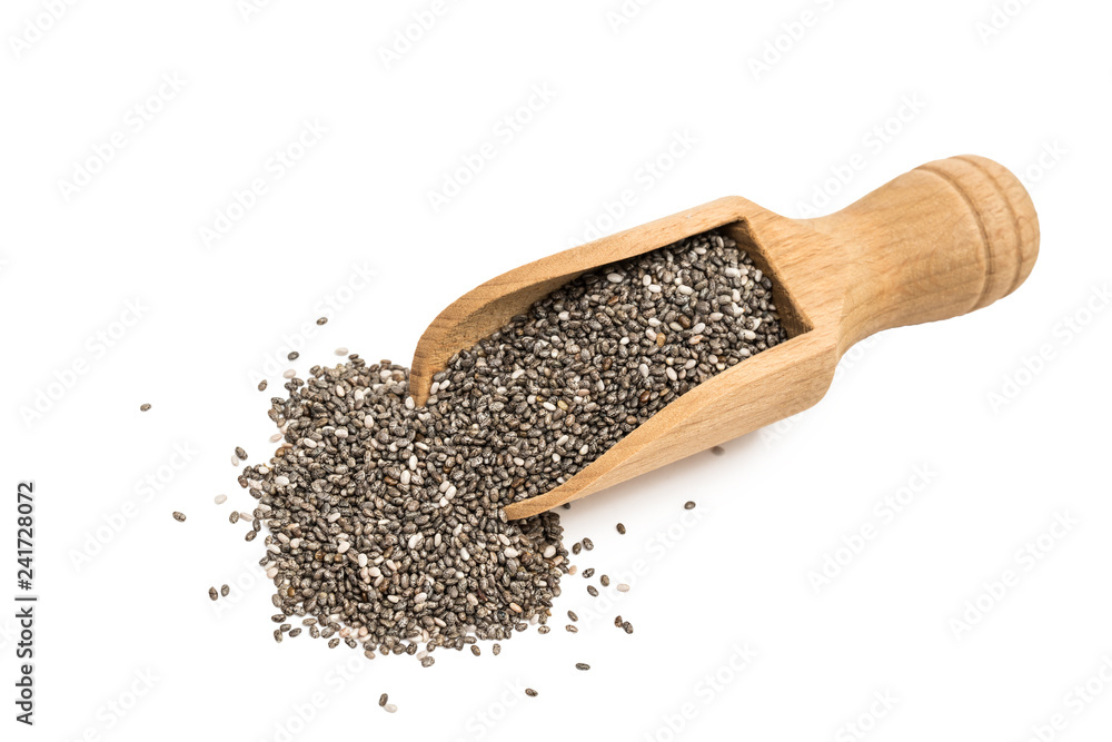 Small wooden spoon or scoop with chia seeds seen from above and isolated on white background Small wooden spoon or scoop with chia seeds seen from above and isolated on white background
