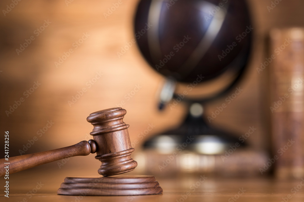 Globe, Law theme, mallet of judge, wooden gavel Globe, Law theme, mallet of judge, wooden gavel