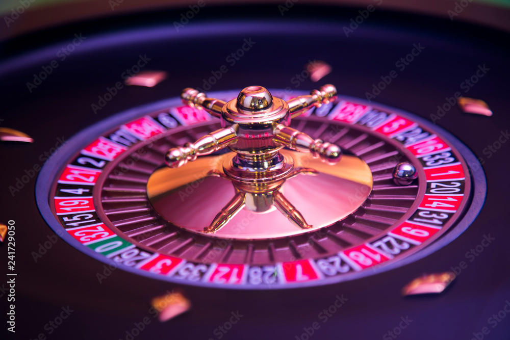 Gaming table, roulette wheel in motion Gaming table, roulette wheel in motion