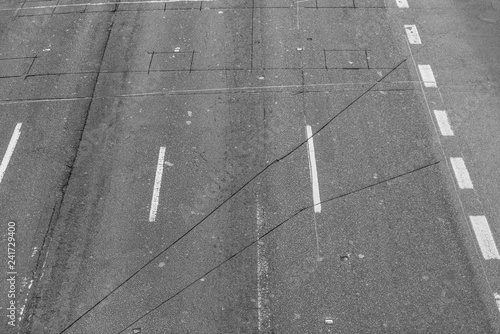 black and white grunge asphalt background.
