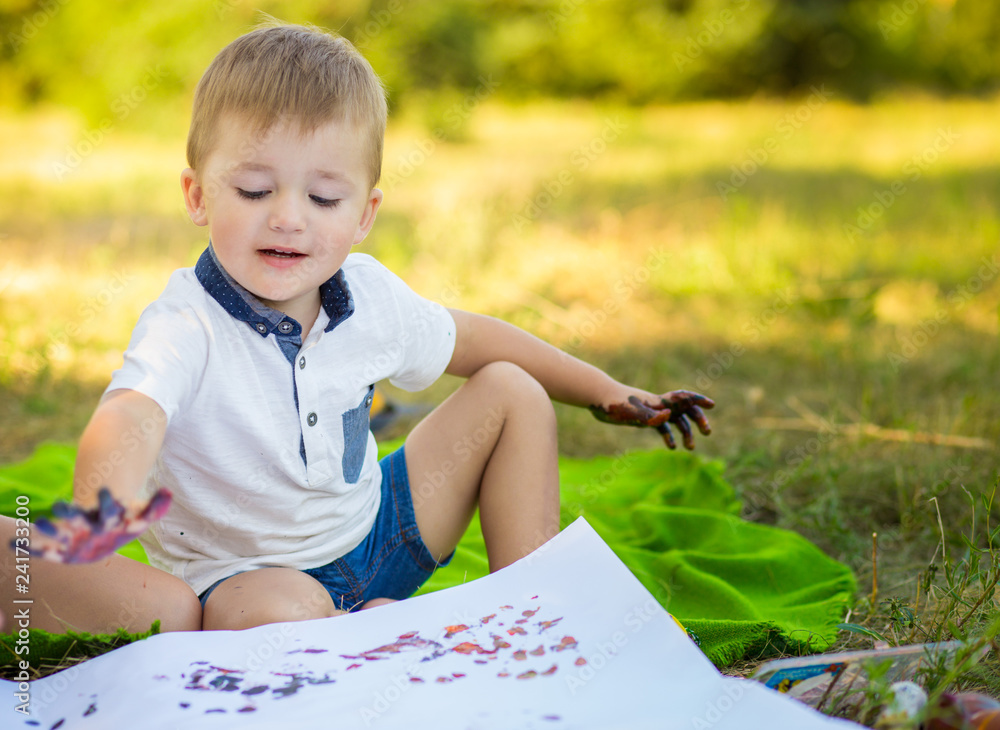 Happy children draw outdoor in summer park. Art concept Happy children draw outdoor in summer park. Art concept