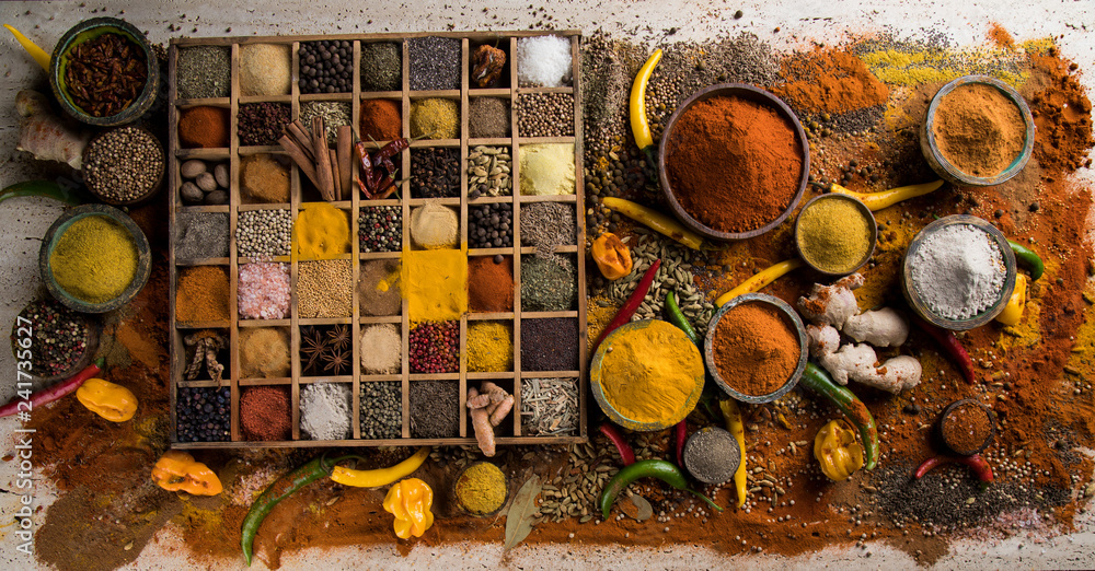 Assortment of spices in wooden bowl background Assortment of spices in wooden bowl background