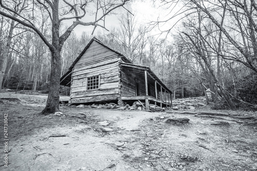 Abandoned Smoky Mountain Cabin. Empty pioneer log cabin sits abandoned and is now a reportedly haunted historical display in the Great Smoky Mountains National Park in Tennessee. 