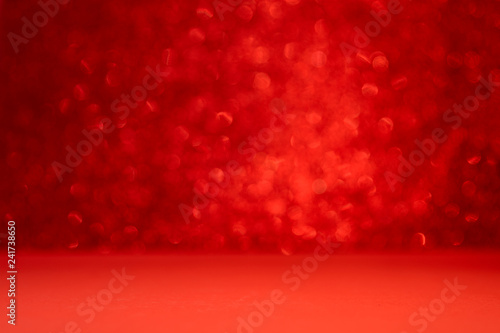 Red background with bokeh. Valentine's day celebration or love concept. Copy space. Defocused