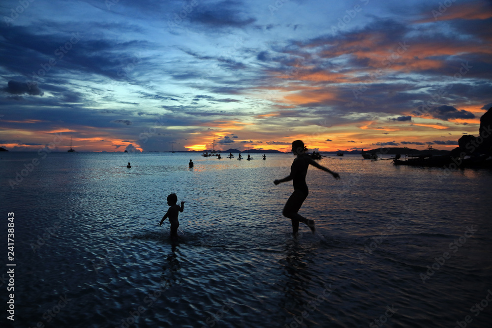 Run follow me, sunset at Railay West beach, Krabi, Thailand