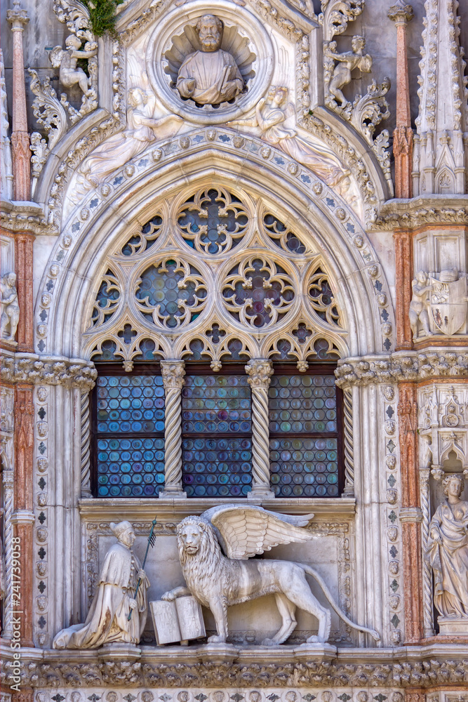 Winged lion and the doge Francesco Foscari above the Paper Gate of the Doge Palace in Venice, Italy.