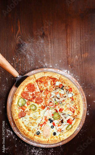 classic Italian pizza on a wooden tray, served in a small authentic Italian restaurant