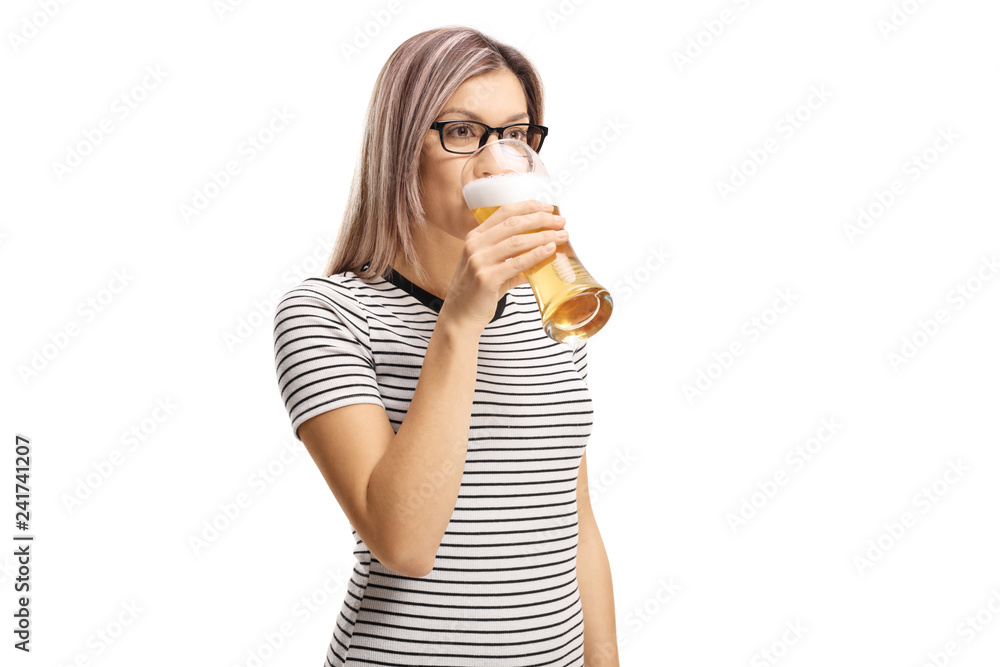 Young woman drinking a glass of beer Young woman drinking a glass of beer