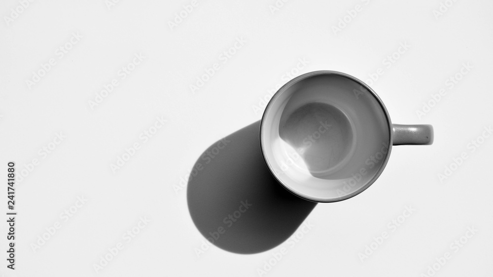 ceramic cup of coffee with shadow - monochrome ceramic cup of coffee with shadow - monochrome