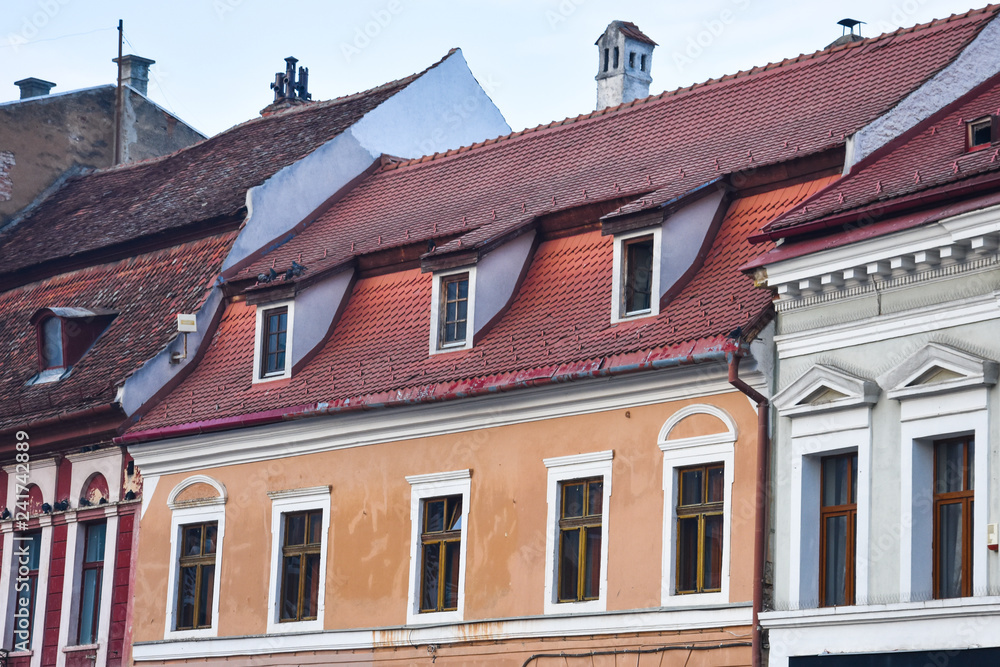 Typical romanian House with tiled roof. Brasov, Romania.