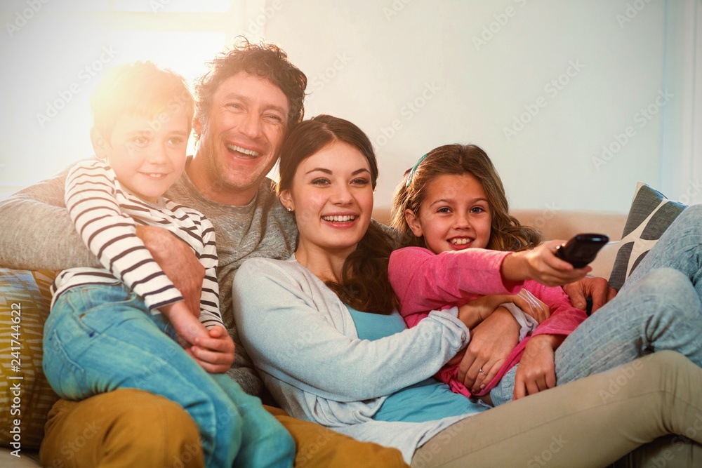 Family enjoying while watching television