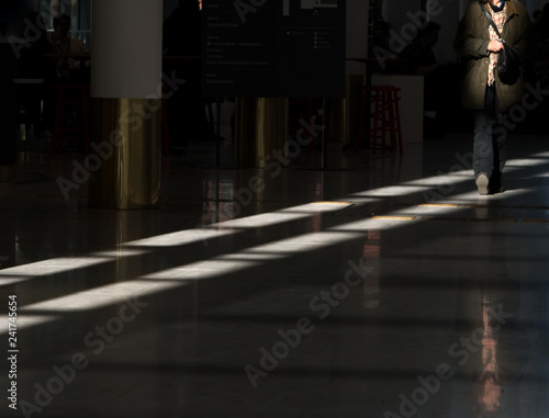 Sunlight on floor with person