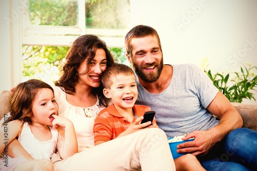Family having fun while watching television © vectorfusionart